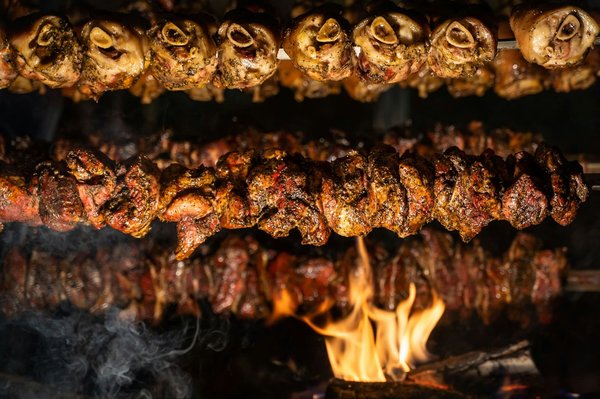 What's the Best Way to Cook a Juicy Rotisserie Chicken with Herbs and Lemons?